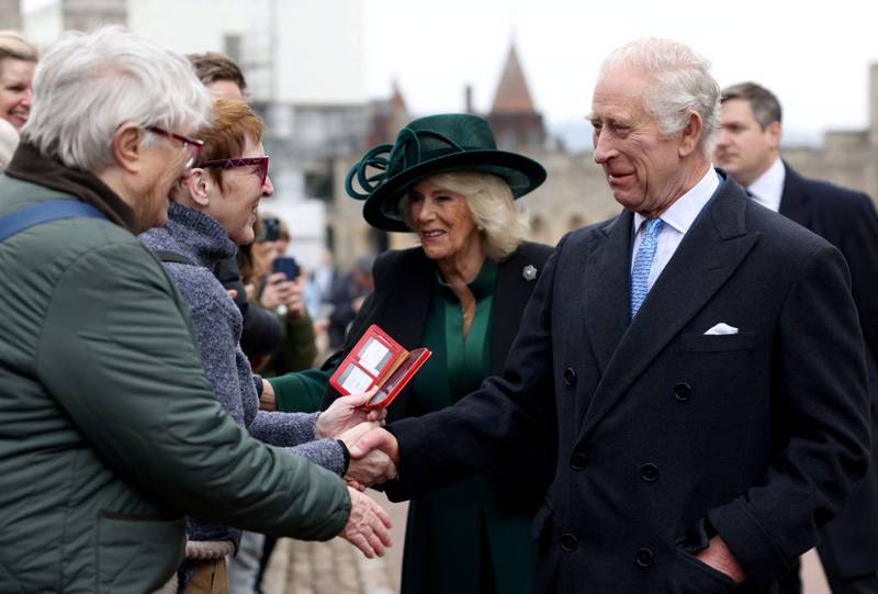 WINDSOR, ENGLAND - MARCH 31: King Charles III and Queen Camilla greet people after attending the Easter Matins Service at St. George's Chapel, Windsor Castle, on March 31, 2024 in Windsor, England. (Photo by Hollie Adams - WPA Pool/Getty Images)